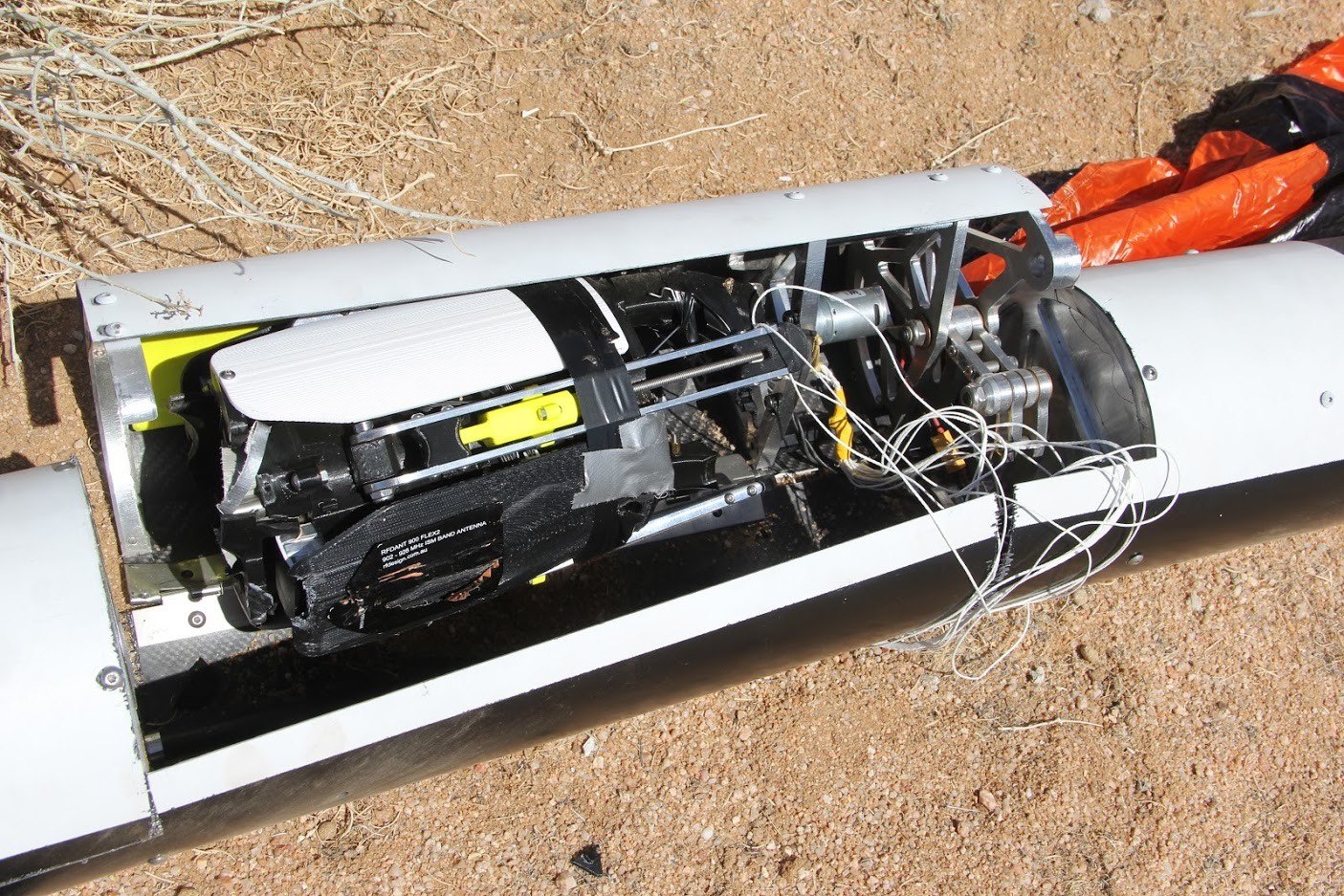 Open payload bay showing avionics and internal hardware inside a Long Beach Rocketry rocket