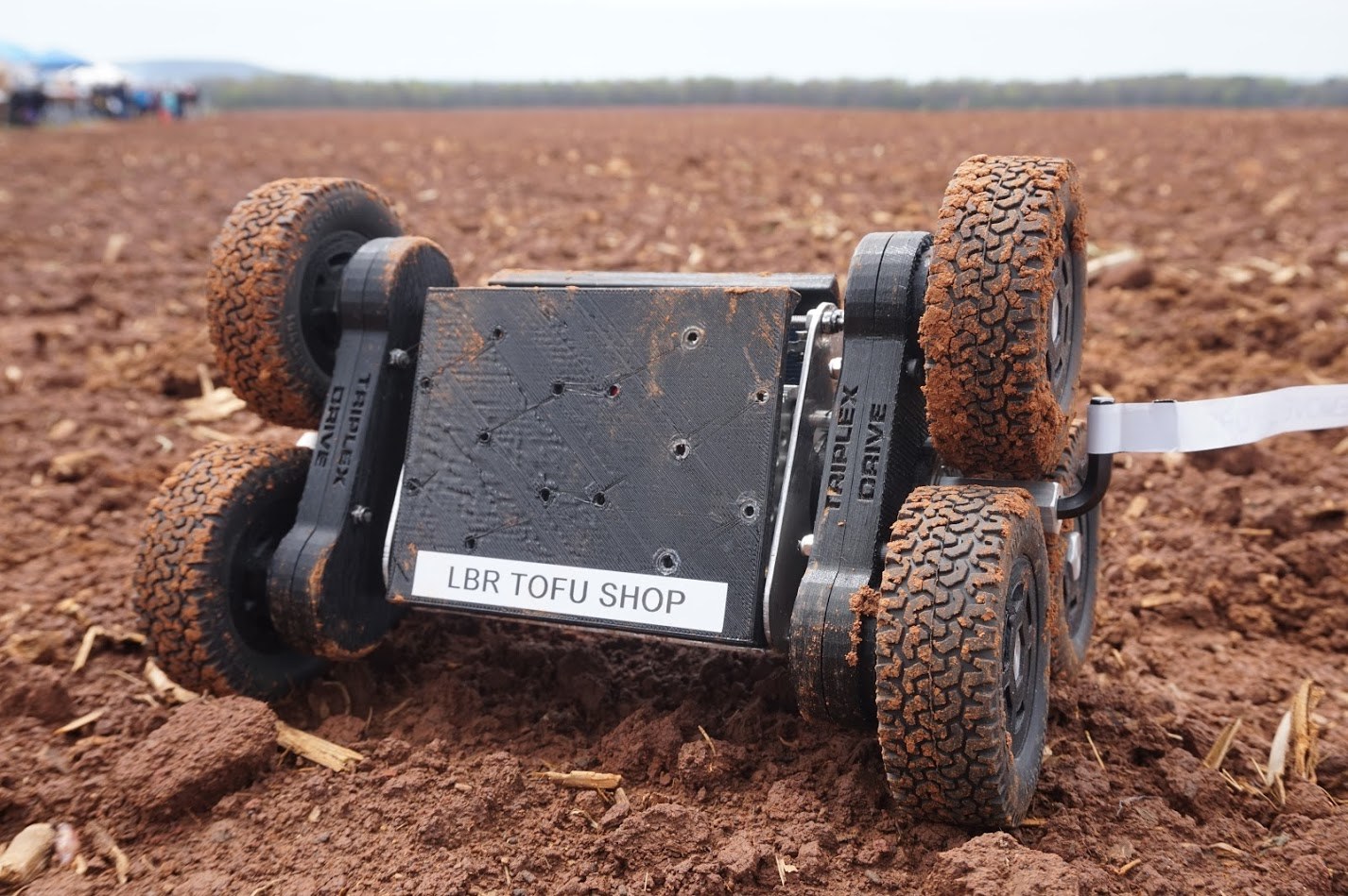 LBR Tofu Shop rover sitting in a muddy field during payload recovery testing